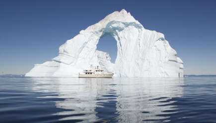 The Bagan in front of an iceberg at Disko Bay, North Greenland. HITW PRODUCTIONS