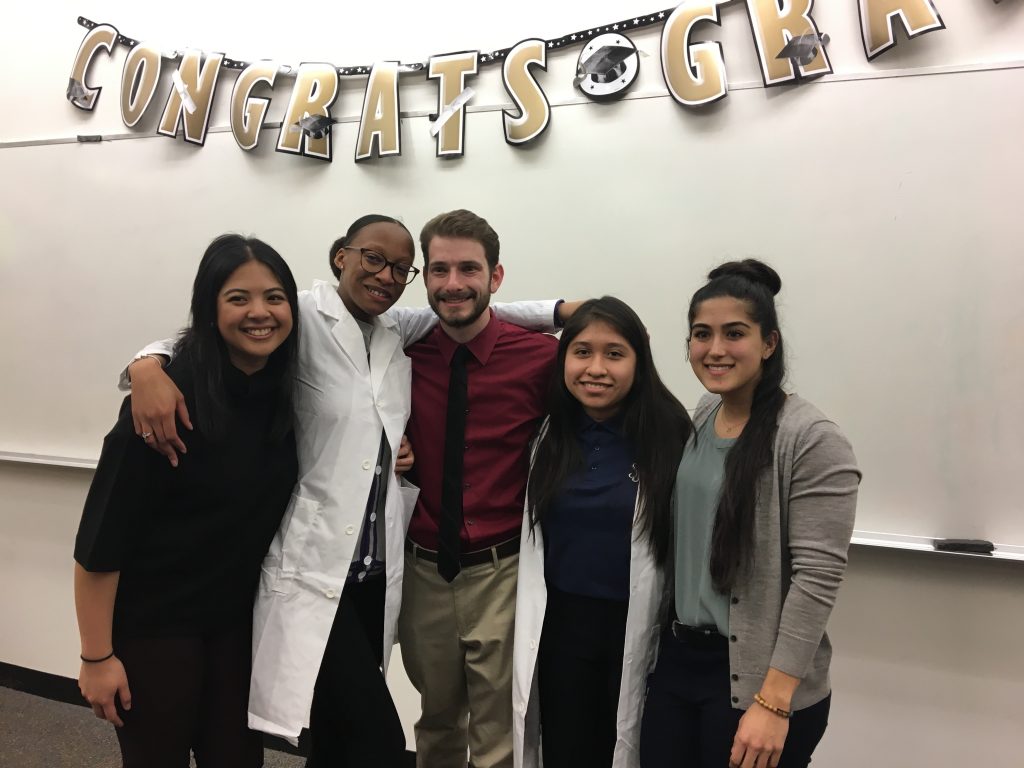 Kayla Simpson second from left and Shaila Cuellar second from right with mentors at graduation.2019