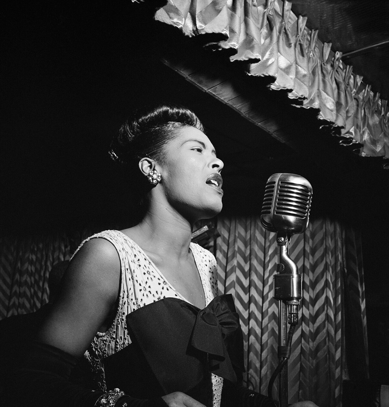 Billie Holiday singing at the Downbeat, New York, 1947